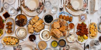 A top-down view of a traditional Turkish feast with assorted dishes and elegant tableware.