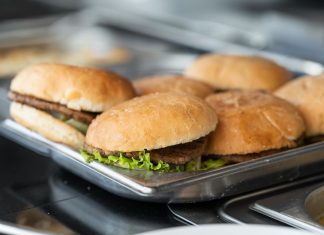 Best Burgers in Newark 2026: A Local’s Guide to Hudson County’s Juiciest Patties Appetizing close-up of freshly made burgers on a stainless steel tray, ready to serve.