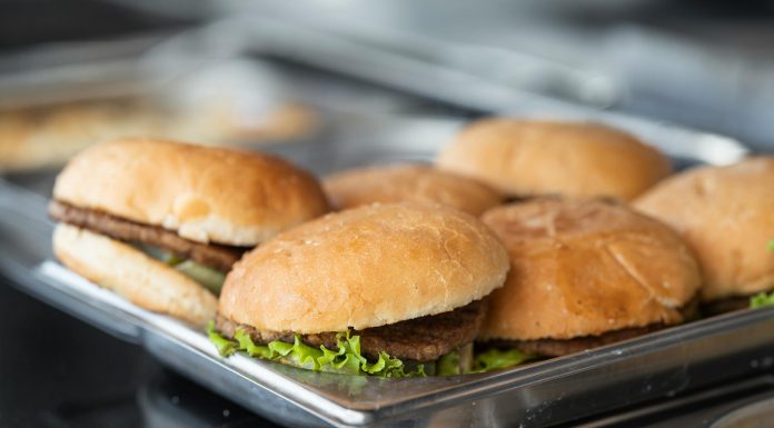 Best Burgers in Newark 2026: A Local’s Guide to Hudson County’s Juiciest Patties Appetizing close-up of freshly made burgers on a stainless steel tray, ready to serve.