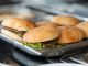 Best Burgers in Newark 2026: A Local’s Guide to Hudson County’s Juiciest Patties Appetizing close-up of freshly made burgers on a stainless steel tray, ready to serve.