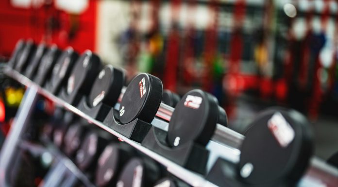 Best Gyms in Hoboken for Every Budget (2026 Guide) Close-up view of dumbbells in a modern gym setting, emphasizing fitness and training.