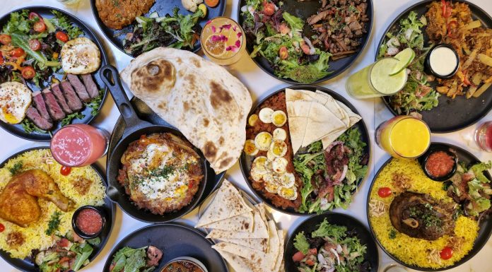 Discover the Best Halal Food in Hoboken: A Local’s Guide for 2026 A vibrant spread of Middle Eastern dishes with fresh salads and drinks, captured in Vancouver.