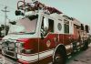 Red and white fire truck from New Braunfels Fire Department parked outdoors.