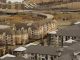 Aerial view of urban residential apartments featuring an American flag, depicting city life.