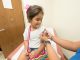 Measles case confirmed in New Jersey—here’s what Hudson County families need to know A cheerful young girl receives a band-aid after a vaccination at a clinic.
