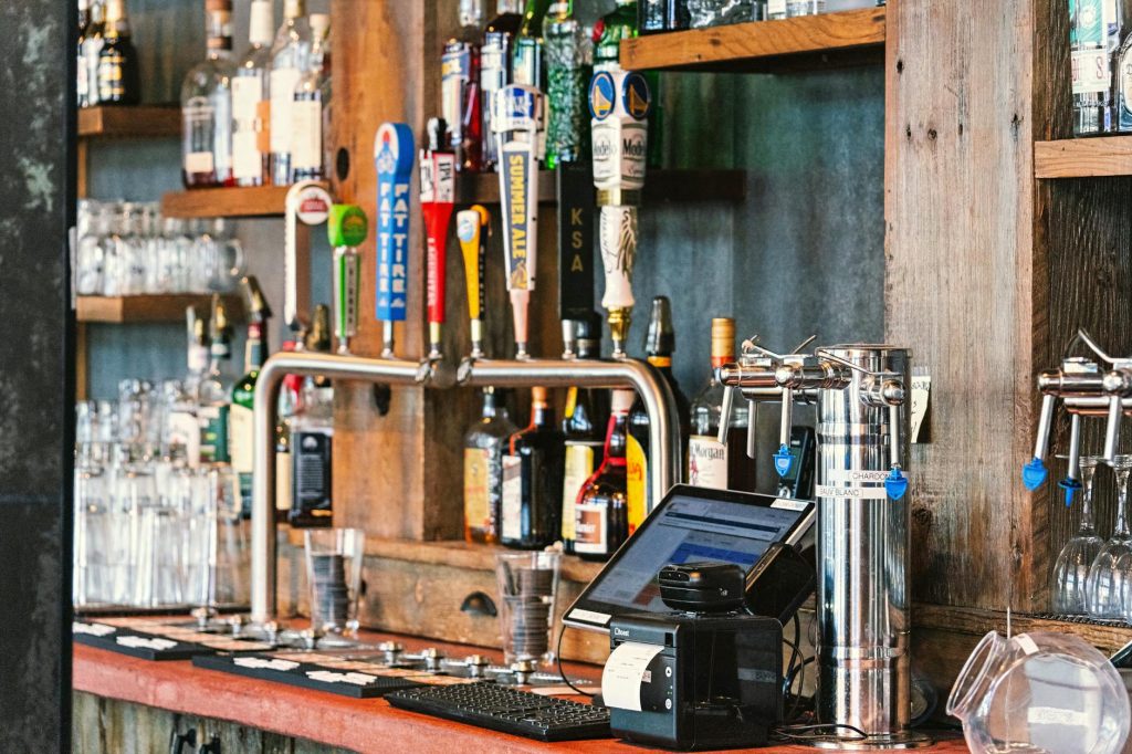 A charming bar setting with an array of craft beer taps and liquor bottles in San Francisco.