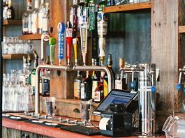 A charming bar setting with an array of craft beer taps and liquor bottles in San Francisco.