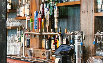 A charming bar setting with an array of craft beer taps and liquor bottles in San Francisco.