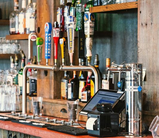 A charming bar setting with an array of craft beer taps and liquor bottles in San Francisco.