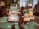 Colorful street food carts on a sunny New York City street offer a diverse culinary experience.