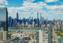 Explore the stunning New York City skyline with a clear view of iconic skyscrapers under a vibrant sky.