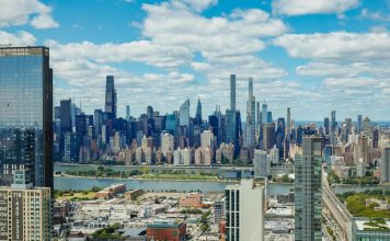 Things Locals Love About Living in West New York (2026 Guide) Explore the stunning New York City skyline with a clear view of iconic skyscrapers under a vibrant sky.