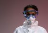 Portrait of a healthcare worker wearing protective gear including goggles and mask.