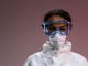 Portrait of a healthcare worker wearing protective gear including goggles and mask.