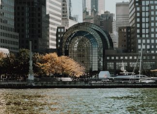 16 NJ Towns for a Day Trip: Your Hudson County Guide Elegant cityscape featuring modern waterfront buildings and a marina in an urban setting.