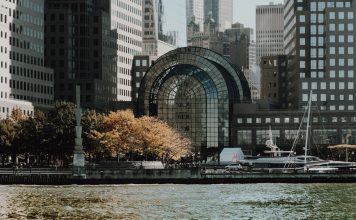 16 NJ Towns for a Day Trip: Your Hudson County Guide Elegant cityscape featuring modern waterfront buildings and a marina in an urban setting.