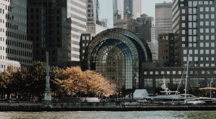 16 NJ Towns for a Day Trip: Your Hudson County Guide Elegant cityscape featuring modern waterfront buildings and a marina in an urban setting.