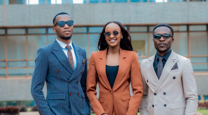 26 Black Leaders Shaping Community in Hudson County Three young professionals in stylish suits posing confidently outdoors.
