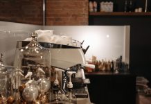 Best Coffee Shops in Elizabeth NJ: A Local’s Guide to the City’s Top Brews in 2026 A cozy coffee shop interior featuring a modern espresso machine and various coffee accessories.