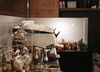 Best Coffee Shops in Elizabeth NJ: A Local’s Guide to the City’s Top Brews in 2026 A cozy coffee shop interior featuring a modern espresso machine and various coffee accessories.
