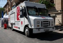 Best Food Trucks in Bayonne: A 2026 Local’s Guide to Top Spots White food truck by LiveChef at a bustling street festival under sunny skies.