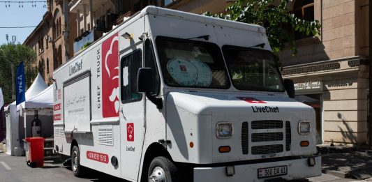 Best Food Trucks in Union City: A Local’s Guide to Mobile Eats in 2026 White food truck by LiveChef at a bustling street festival under sunny skies.