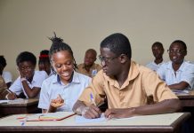 Best High Schools in Elizabeth: Ranked for 2026 High school students collaborating during a lesson in a classroom environment.