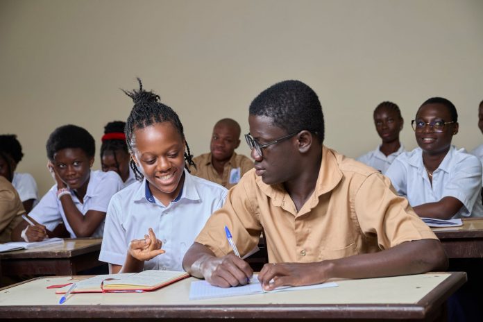 best-high-schools-elizabeth-2026 High school students collaborating during a lesson in a classroom environment.