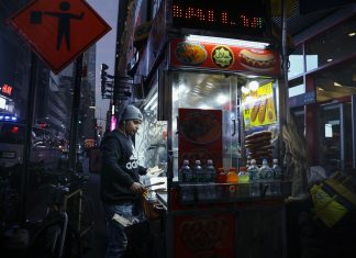 Best Late Night Food in Newark (2026 Guide): Where to Eat After Dark Urban street food vendor serving at night in New York City, capturing the bustling nightlife.
