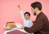 Best Private Schools Near Bayonne: Top Options for Your Child in 2026 Teacher aids enthusiastic student in classroom setting, enhancing learning experience.