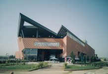Exterior of modern Prime Mall shopping center in urban Turkey, showcasing architectural design.