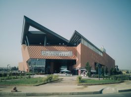 Exterior of modern Prime Mall shopping center in urban Turkey, showcasing architectural design.