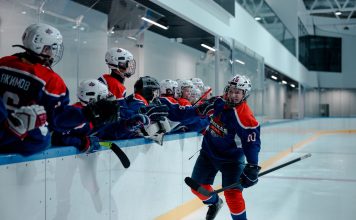 BREAKING: Hoboken Rockets Win Three Championships in One Season Ice hockey team players celebrating during a game in an indoor rink.