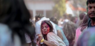 BREAKING: Jersey City Hosts Color Festival, Night Market This Weekend Vibrant Holi festival scene with people celebrating with colorful powders outdoors.
