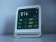 A sleek air quality monitor showing CO2 and other air metrics, ideal for smart homes.