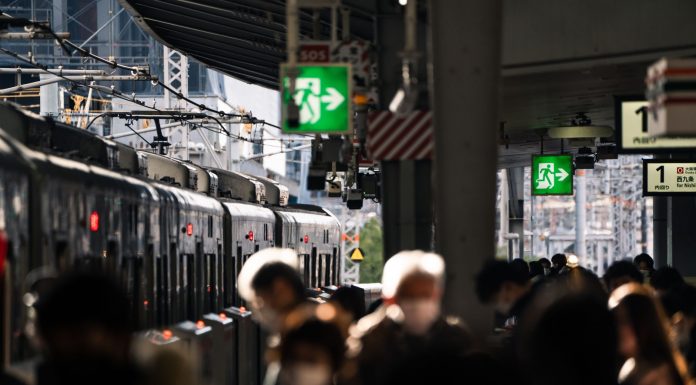 BREAKING: NJ Transit Faces Major Test During World Cup Rush Crowd at Osaka train station platform with train in view, showcasing urban travel hustle.