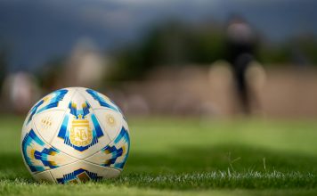 BREAKING: NJCU, Kean Partner for FIFA World Cup Consular Services Close-up of an official Argentine soccer ball resting on a green field with a blurred background.