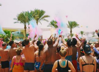 BREAKING: Vibrant weekend events set for Jersey City on June 6-7 A lively outdoor Holi celebration on the beach with colorful powder and a joyful crowd.