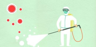 Decorative paper appliques of cleaning person in protective equipment spraying disinfectant during COVID 19 pandemic on green background
