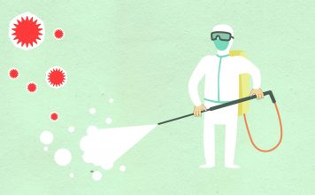 Decorative paper appliques of cleaning person in protective equipment spraying disinfectant during COVID 19 pandemic on green background