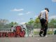 Man with skateboard at urban skatepark, Clifton NJ. Vibrant graffiti art.