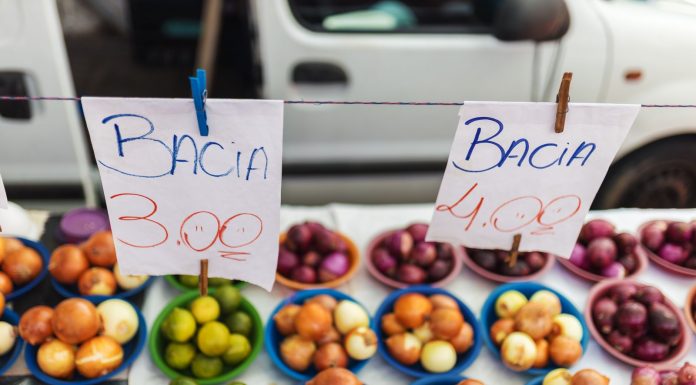 Colorful assortment of fruits and vegetables on display at a vibrant market stall.