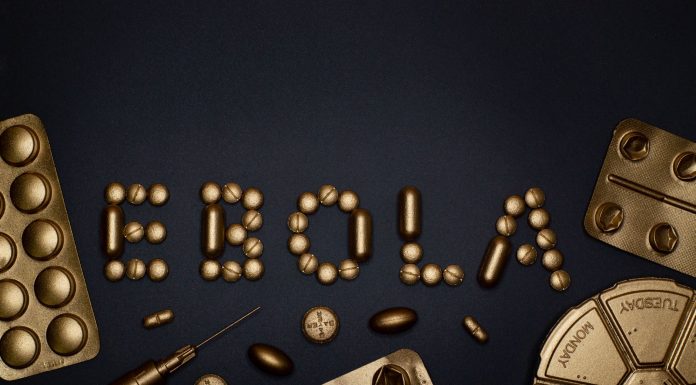 Creative arrangement of pills spelling 'EBOLA', showcasing a conceptual healthcare theme.