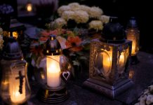 Elizabeth Says Goodbye to Cinthia D Remedios Gonzalez Lanterns with candles illuminate a cemetery on All Saints' Day.