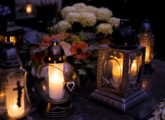 Elizabeth Says Goodbye to Cinthia D Remedios Gonzalez Lanterns with candles illuminate a cemetery on All Saints' Day.