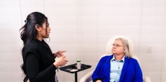 Evolve Med Spa Brings Back Skin + Body Event on June 25 Female professional consulting with senior client in a Santa Ana med spa.