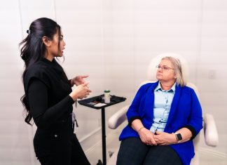 Female professional consulting with senior client in a Santa Ana med spa.