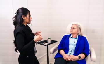 Female professional consulting with senior client in a Santa Ana med spa.