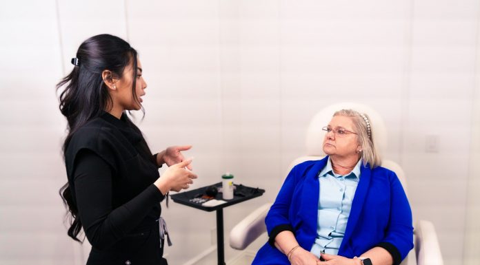 Evolve Med Spa Brings Back Skin + Body Event on June 25 Female professional consulting with senior client in a Santa Ana med spa.