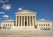 Hoboken Candidate Sues to Get on Ballot After Petitions Fall Short The majestic facade of the United States Supreme Court under a clear blue sky.